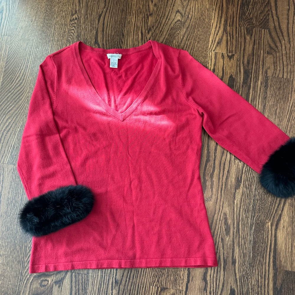 Harold’s Red sweater with rabbit fur trim.